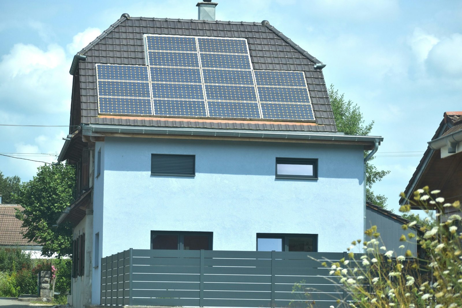 A house with a solar panel on the roof