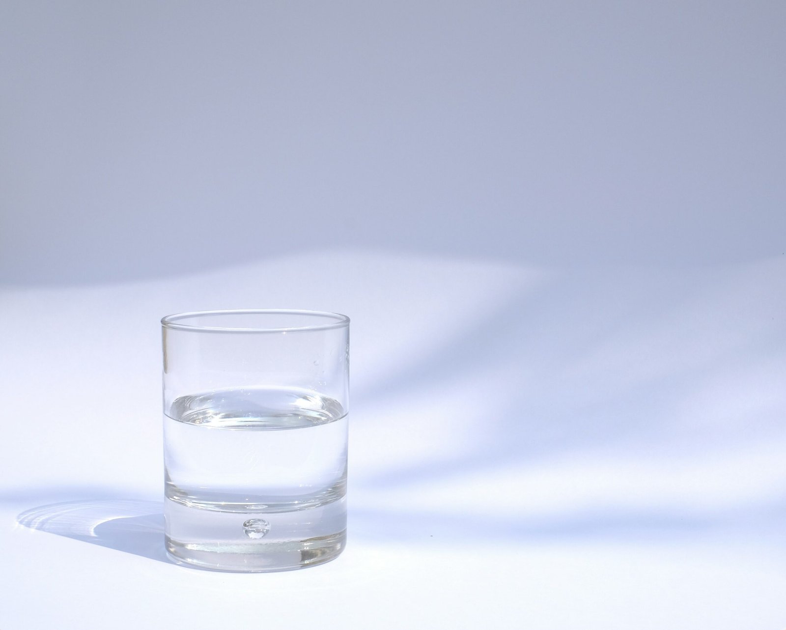 clear drinking glass filled with water